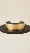 Minimalist gold cuff bracelet with brushed finish